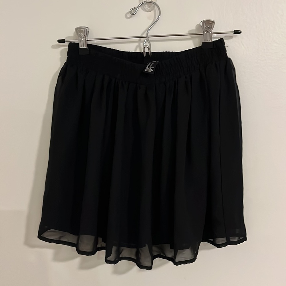 Forever 21 Woman’s XS sheer black skirt with lining. 100 % Polyester